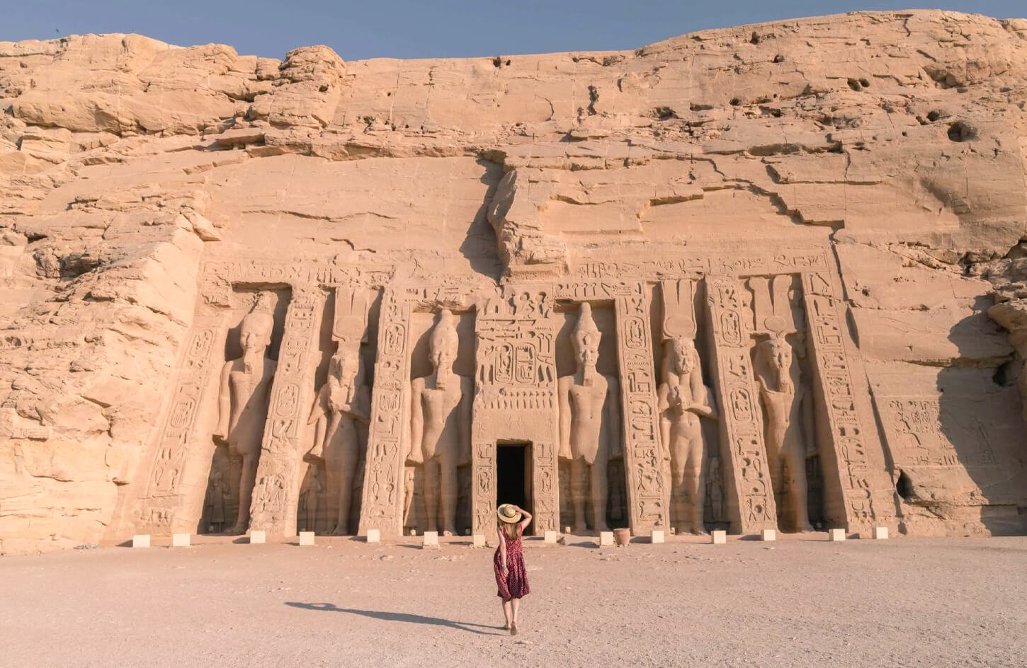 A wonderful picture of a girl in front of Abu Simbel Ancient Egyptian Temples
