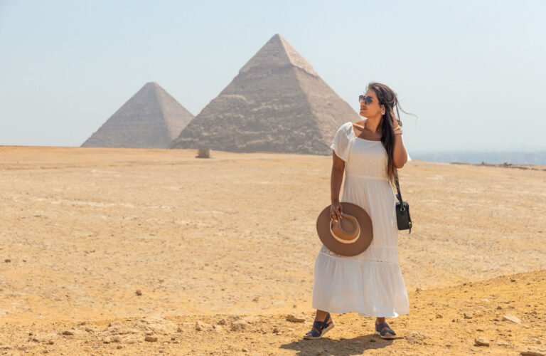 A wonderful picture of a tourist in front of the pyramids