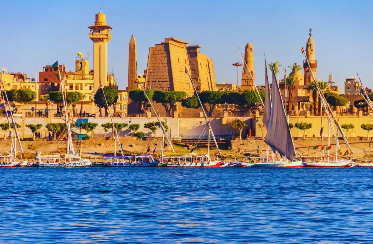 a panoramic view of the magnificent luxor temple gracefully situated along the serene banks of the nile river