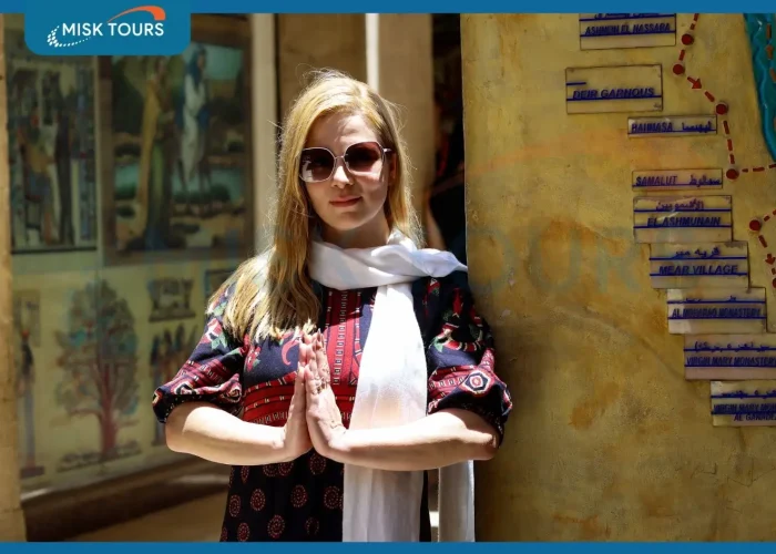A-wonderful-picture-of-a-woman-standing-in-front-of-the-Holy-Family-trail-map