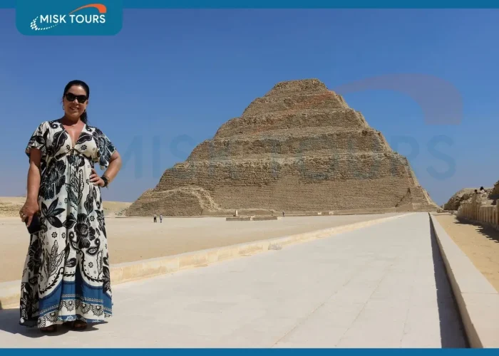 a-wonderful-picture-of-a-woman-standing-in-front-of-the-step-pyramid-of-djoser