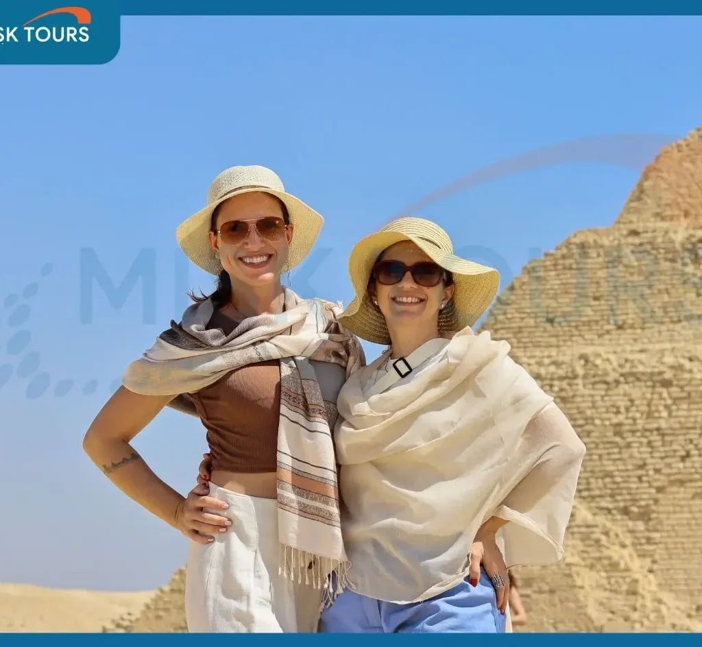 happy-woman-tourist-with-arms-raised-at-step-pyramid-of-djoser-saqqara.