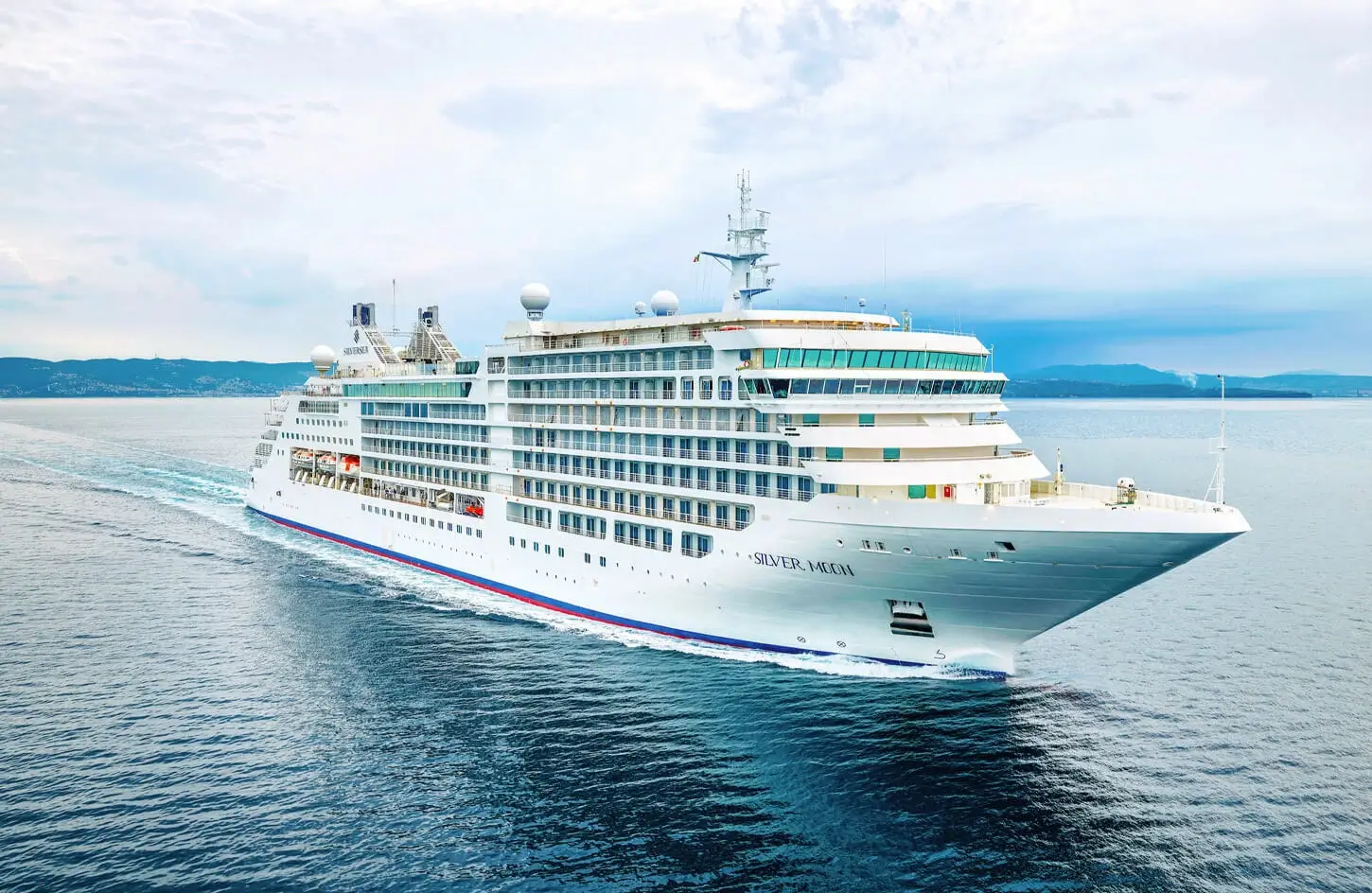 The ultra-luxury Silversea cruise ship, Silver Moon, sailing on clear waters during an elite Egypt and Mediterranean cruise tour.