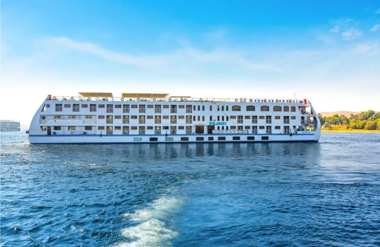 Solaris cruise ship sailing on the blue waters of the Nile River during a luxury 3 Nights Nile Cruise.