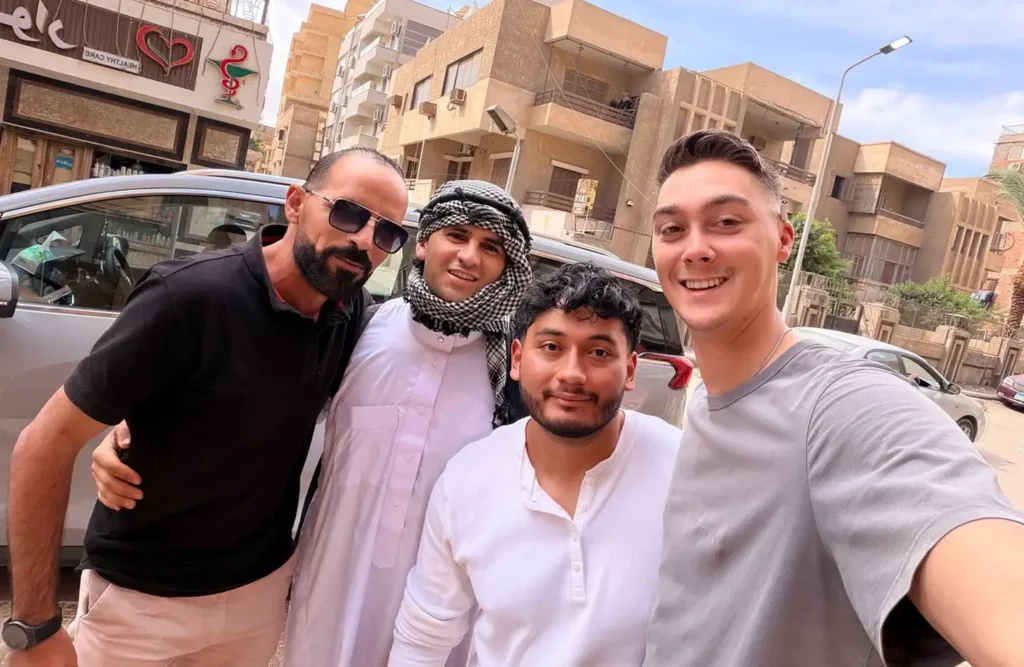A stunning image of four men taking a selfie on a city street in egypt