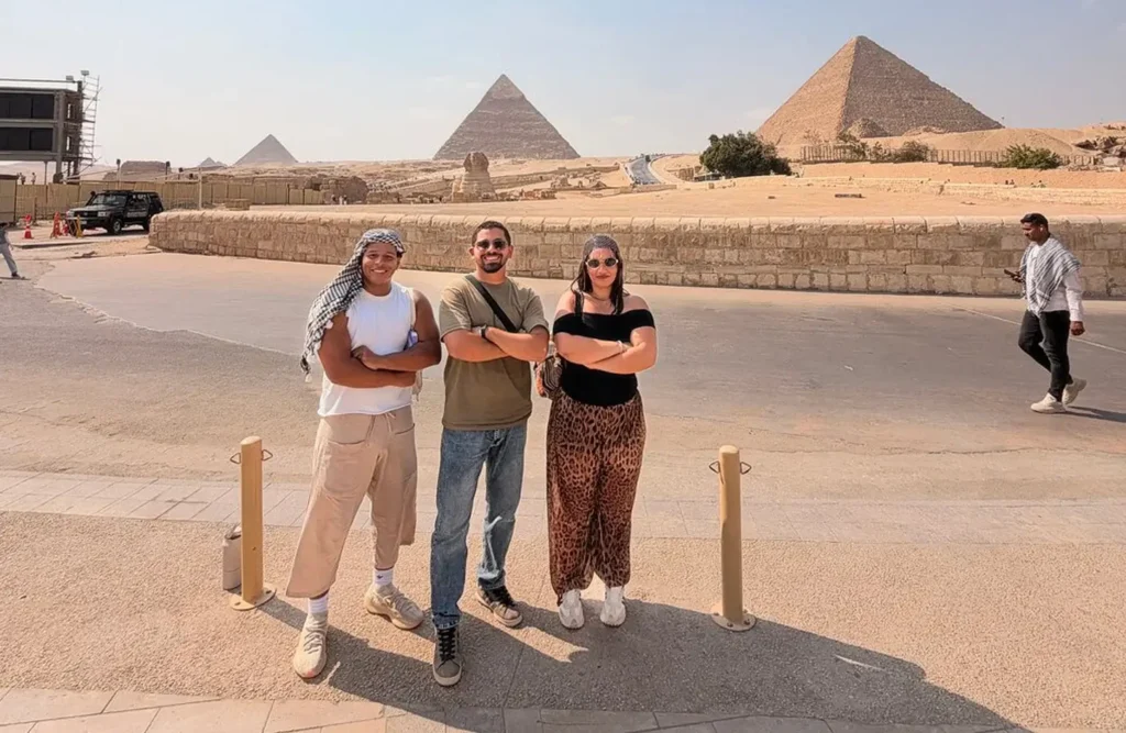 A family with their Misk Tours guide in front of Luxor Temple
