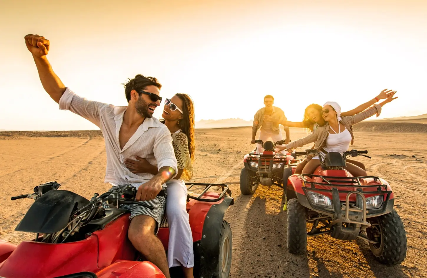 Group of friends on a quad bike trip near the Giza Pyramids