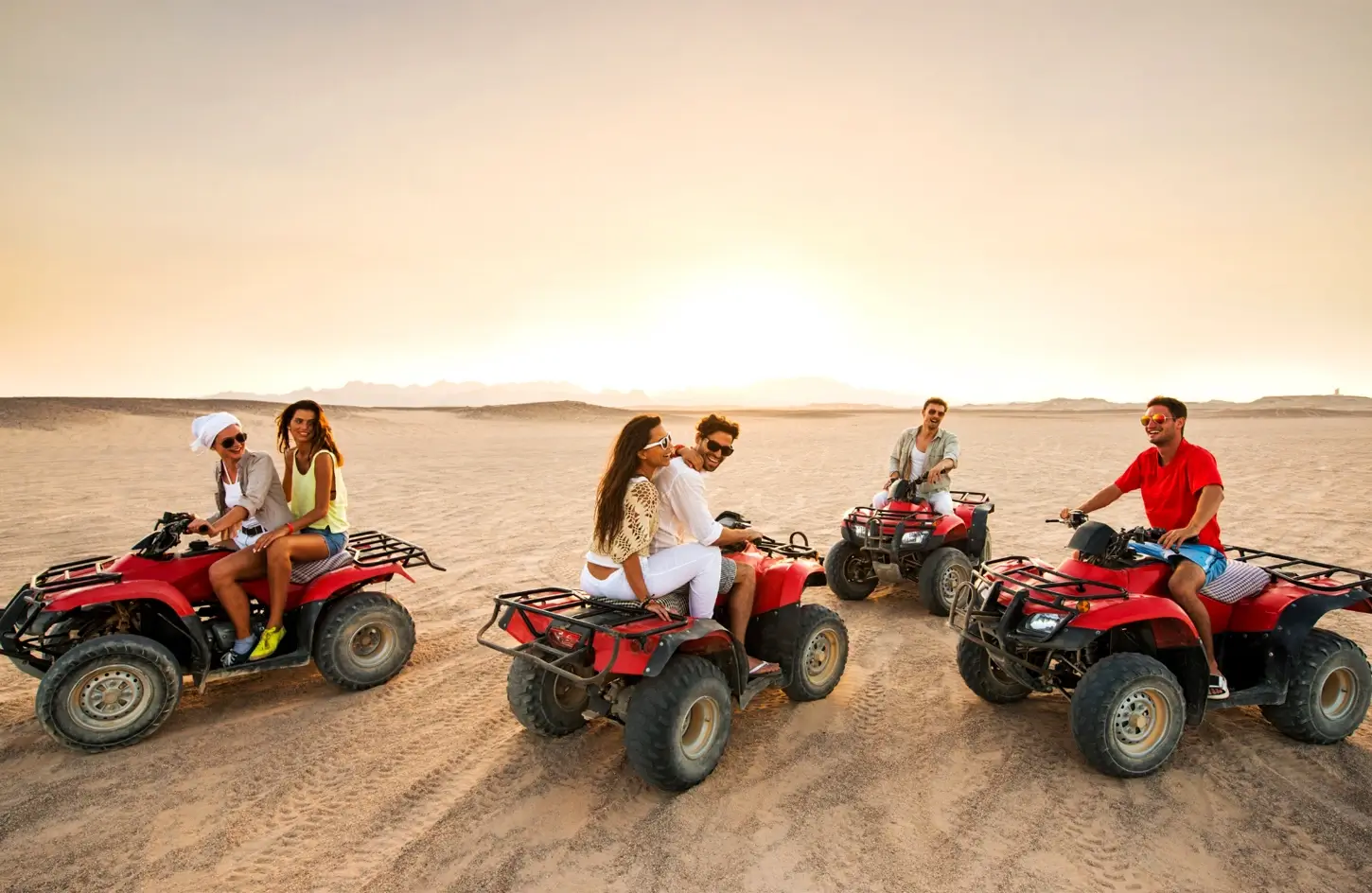 Group of tourists on a quad bike ride near the Giza Pyramids