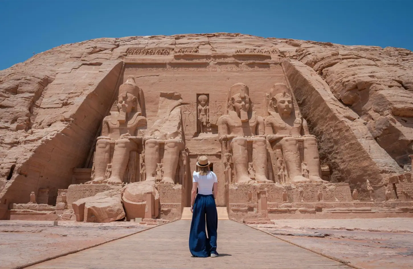 Visitor standing in front of the Temple of Ramesses II at Abu Simbel