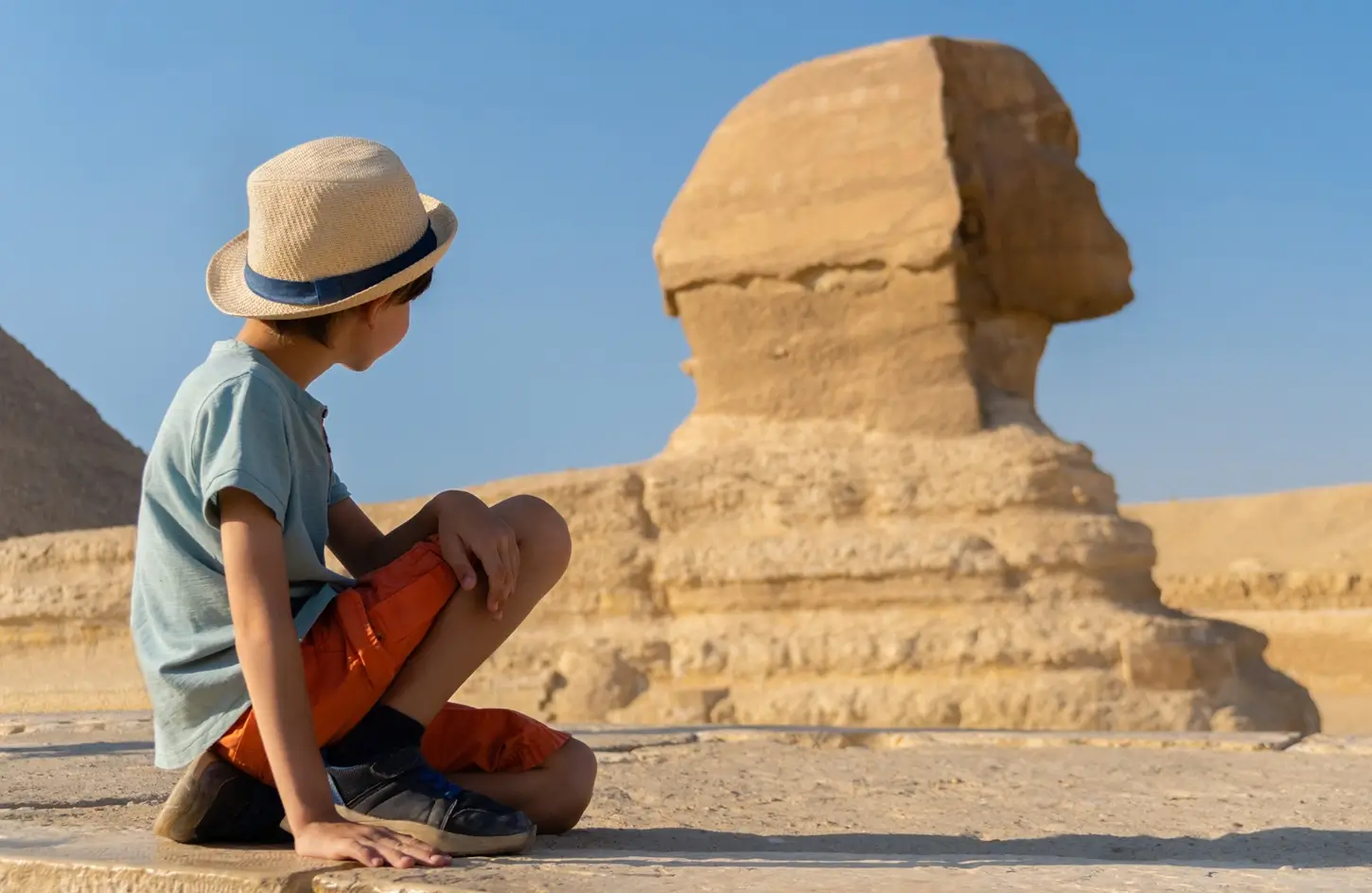 Child taking a photo in front of the Sphinx, Giza